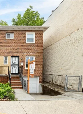 a view of a brick house with many windows