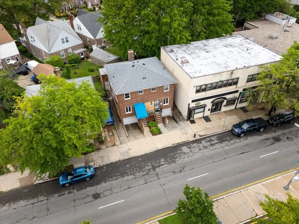 an aerial view of a house with outdoor space