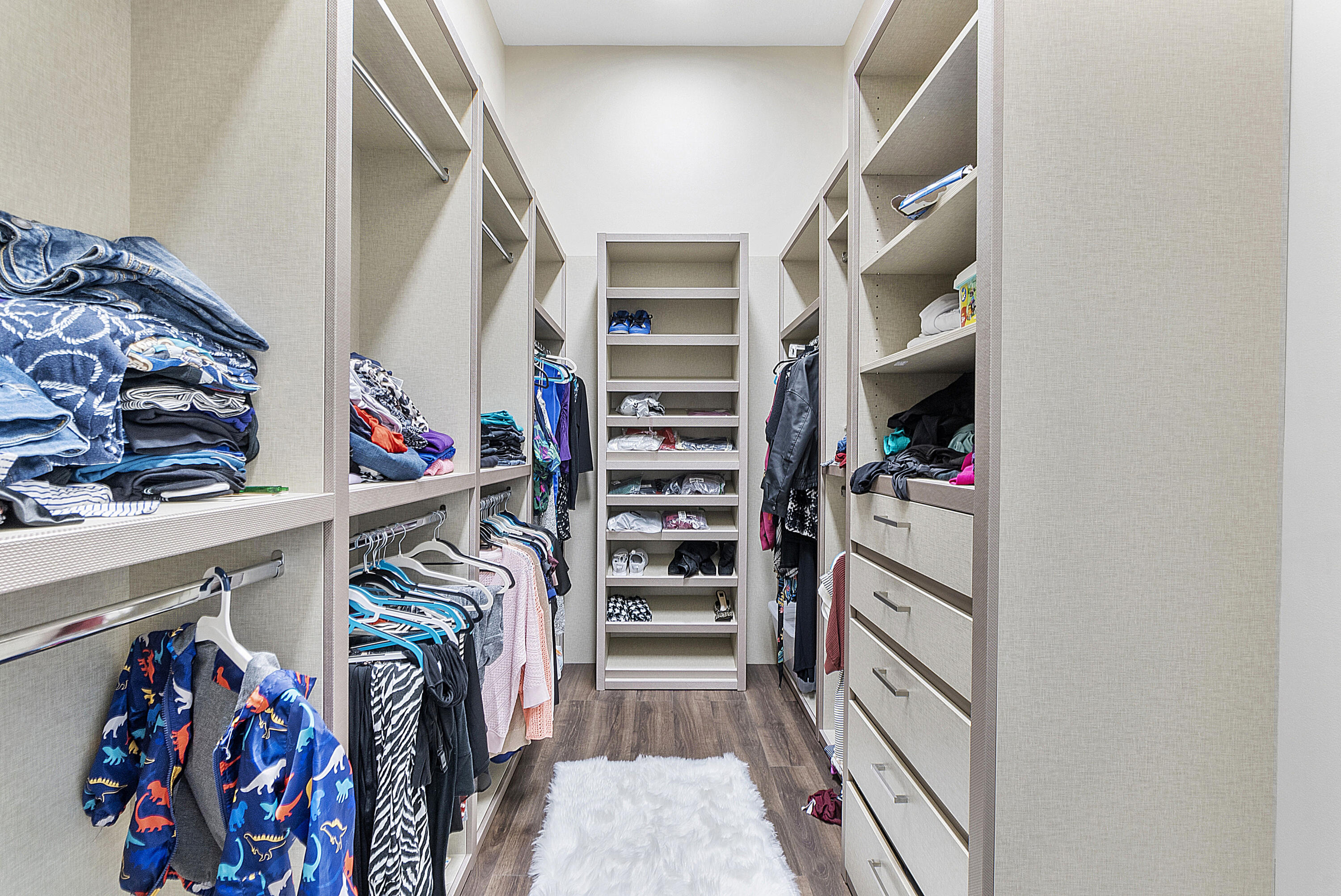 16897 Pierre Circle Delray Beach, FL 33446 - Photo 22 of 37 a view of walk in closet with clothes and shoes