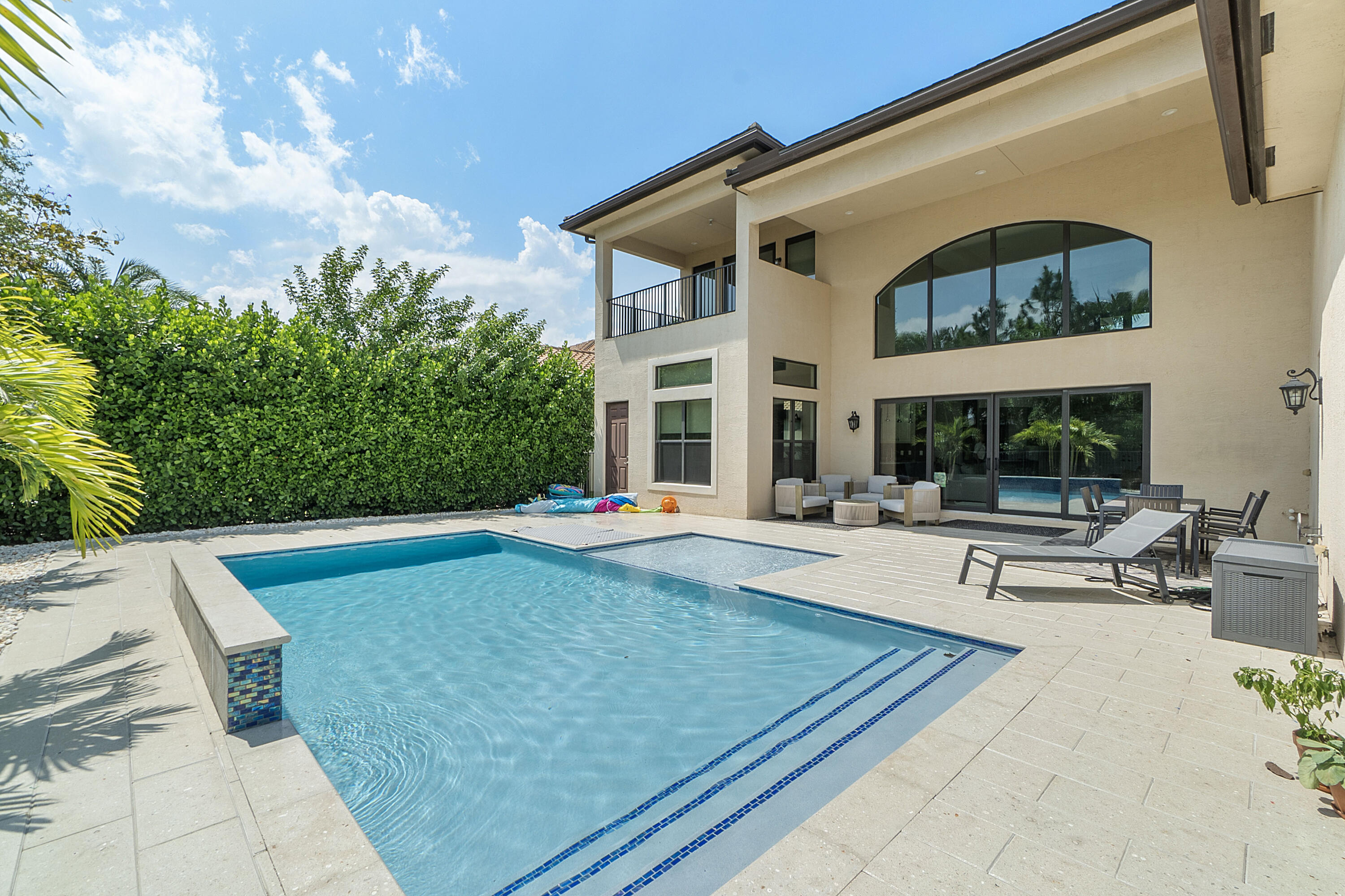 16897 Pierre Circle Delray Beach, FL 33446 - Photo 27 of 37 a view of a house with swimming pool and sitting area