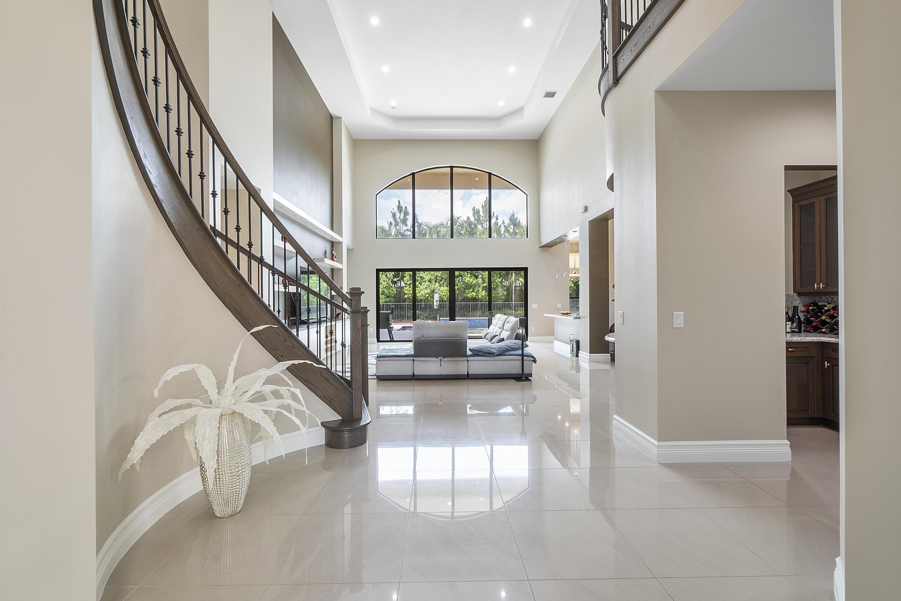 16897 Pierre Circle Delray Beach, FL 33446 - Photo 5 of 37 a view of entryway and hall with wooden floor