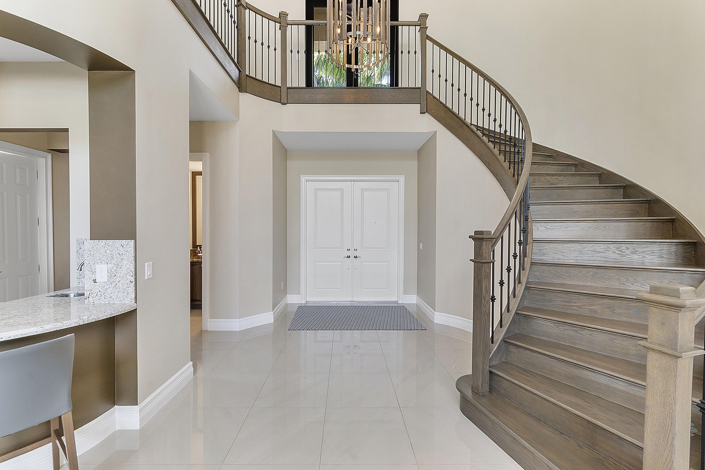 16897 Pierre Circle Delray Beach, FL 33446 - Photo 9 of 37 a view of entryway and hall with wooden floor