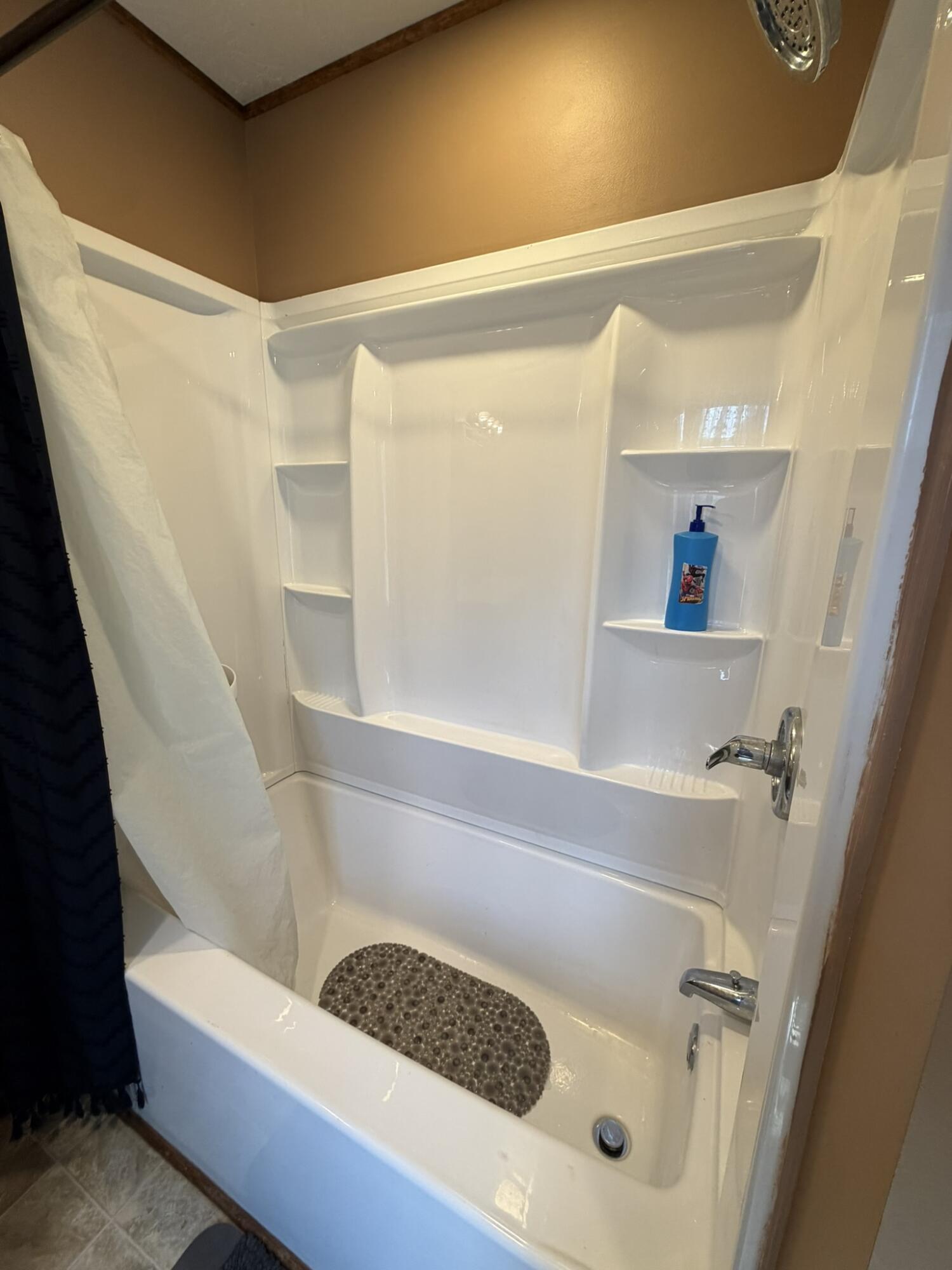 1410 Winston Road Irvine, KY 40336 - Photo 31 of 43 This home offers the best of both worlds: a spacious walk-in shower in the owner's suite and a tub/shower combo in the guest bathroom!