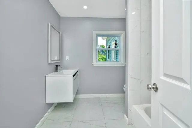 a bathroom with a sink and a bathtub