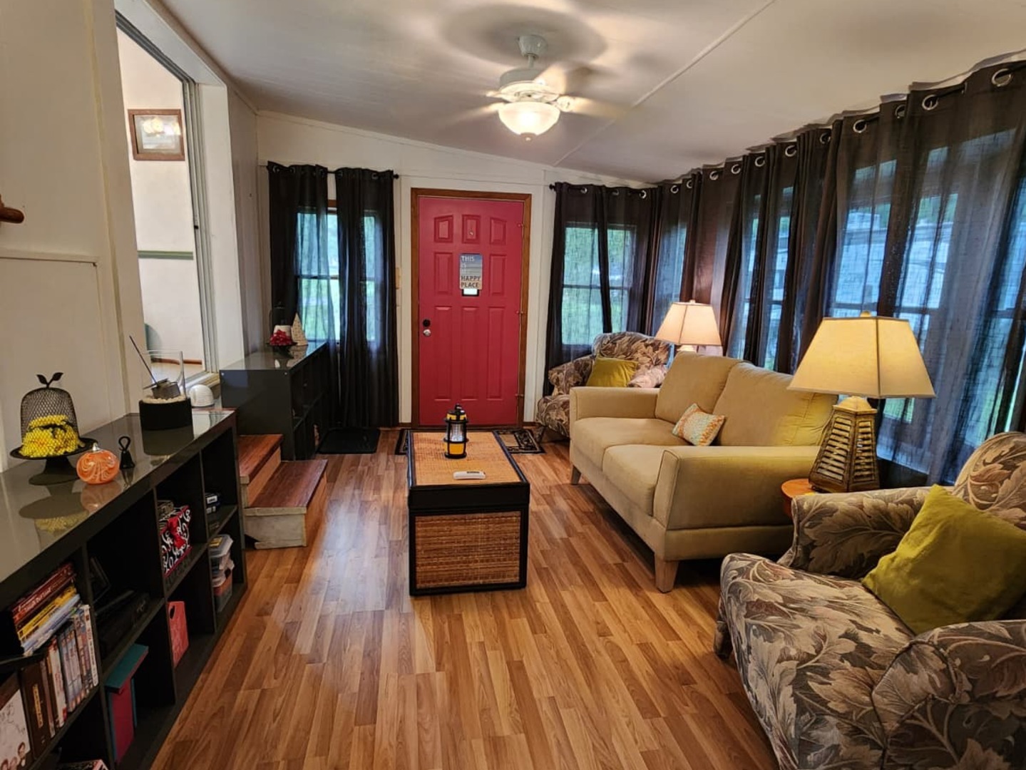 28-21 Woodhaven Sublette, IL 61367 - Photo 24 of 35 a living room with furniture a lamp wooden floor and a large window