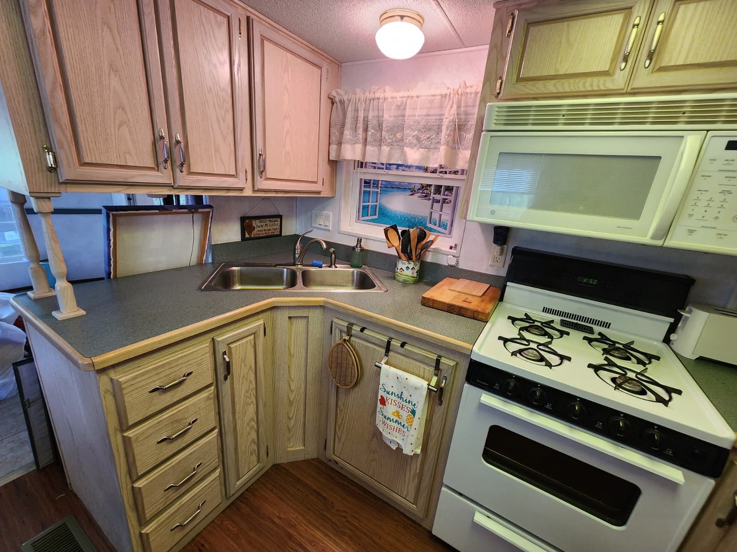 28-21 Woodhaven Sublette, IL 61367 - Photo 28 of 35 a kitchen with a stove and a microwave