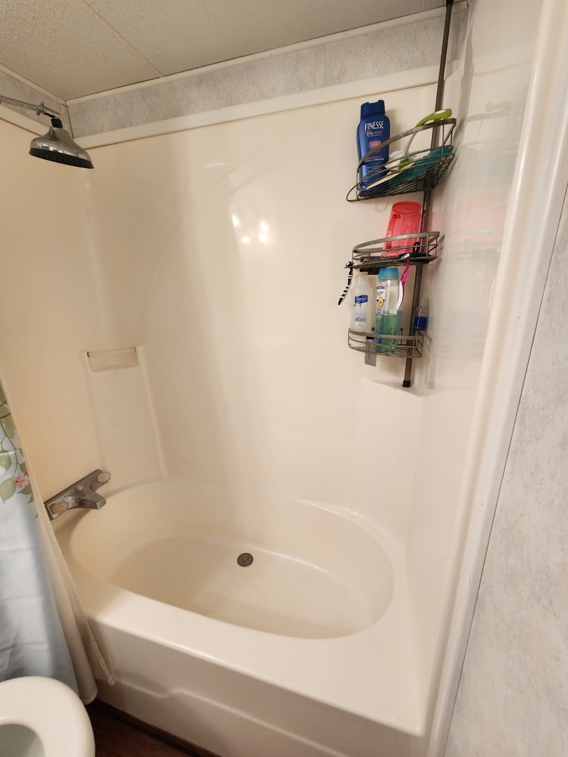 28-21 Woodhaven Sublette, IL 61367 - Photo 34 of 35 a bathroom with a sink and a bath tub