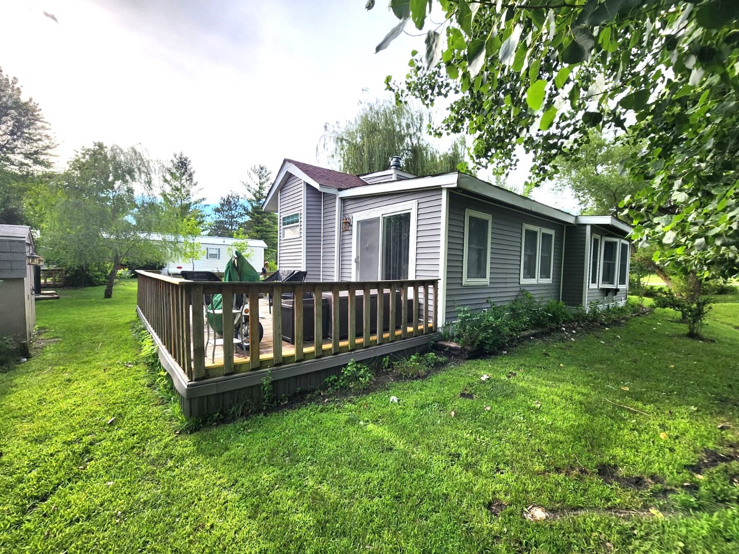 28-21 Woodhaven Sublette, IL 61367 - Photo 5 of 35 a view of a house with backyard and a deck