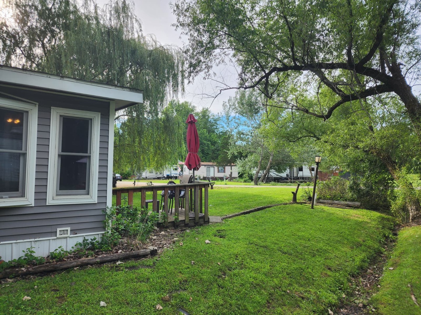 28-21 Woodhaven Sublette, IL 61367 - Photo 7 of 35 a view of a house with backyard and a garden