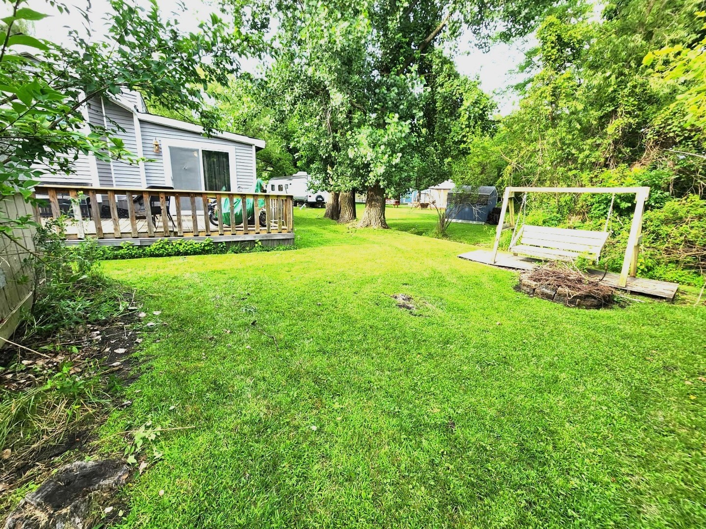 28-21 Woodhaven Sublette, IL 61367 - Photo 9 of 35 a front view of a house with garden