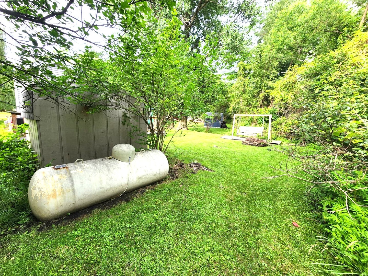 28-21 Woodhaven Sublette, IL 61367 - Photo 10 of 35 a view of a backyard with table and chairs