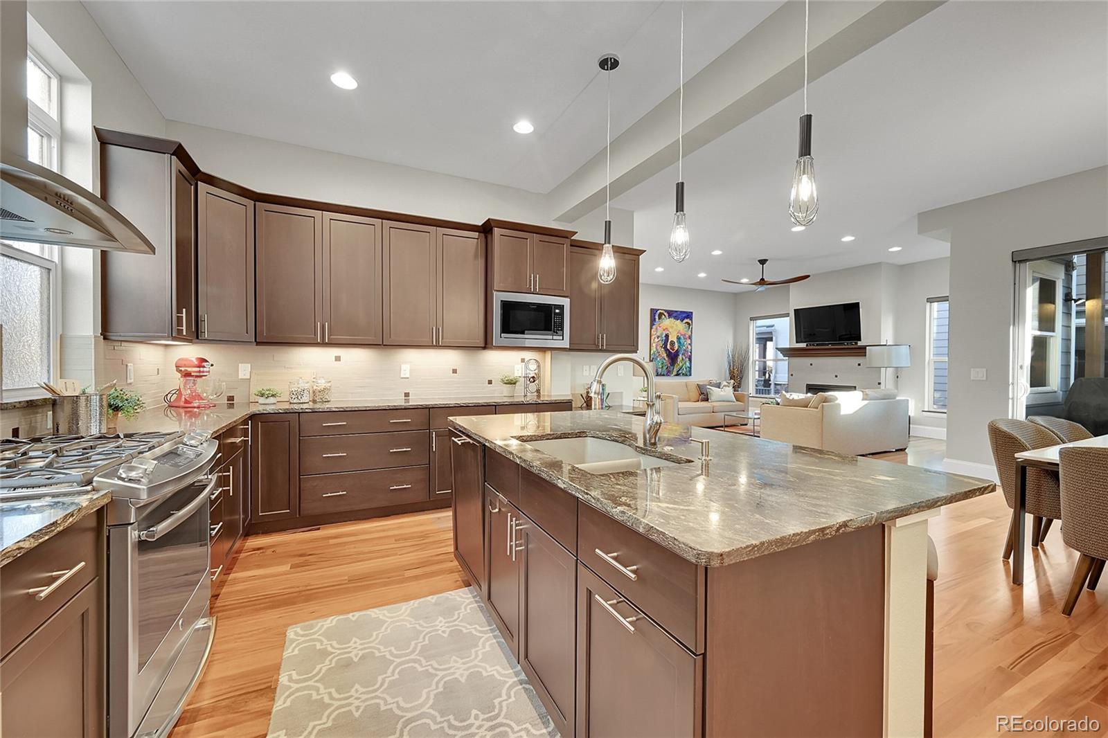 3693 Silverton Street Boulder, CO 80301 - Photo 13 of 50 a kitchen with a sink stove cabinets and refrigerator