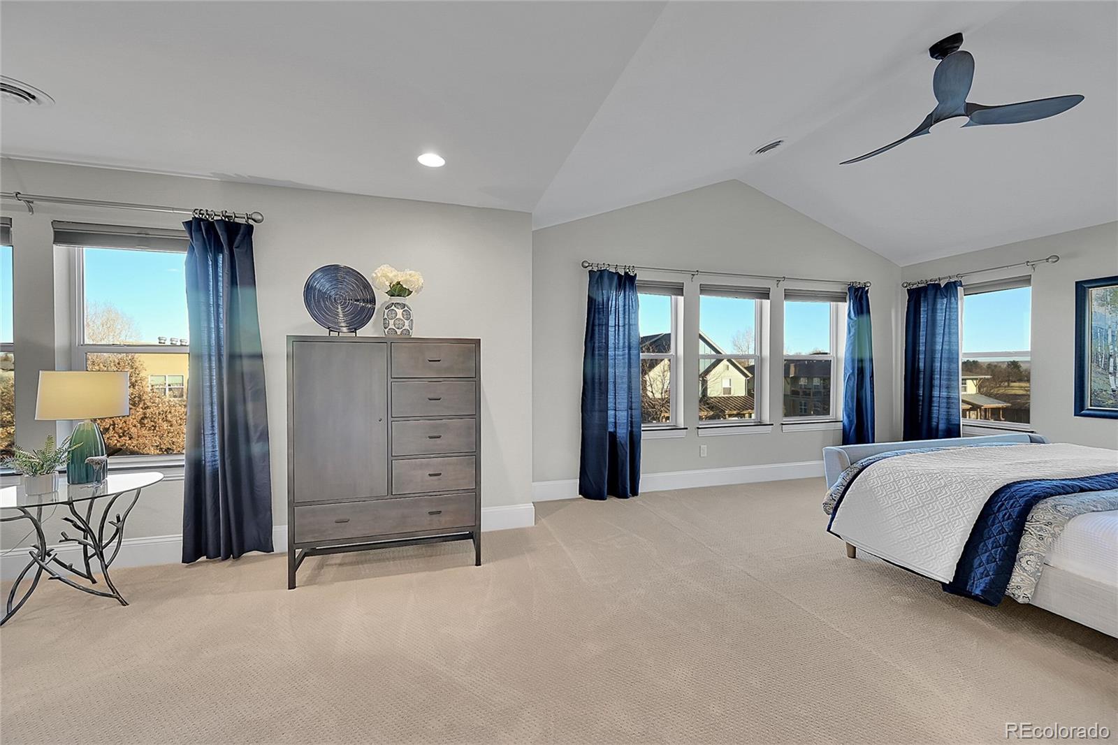 3693 Silverton Street Boulder, CO 80301 - Photo 17 of 50 a spacious bedroom with a large bed and a large window