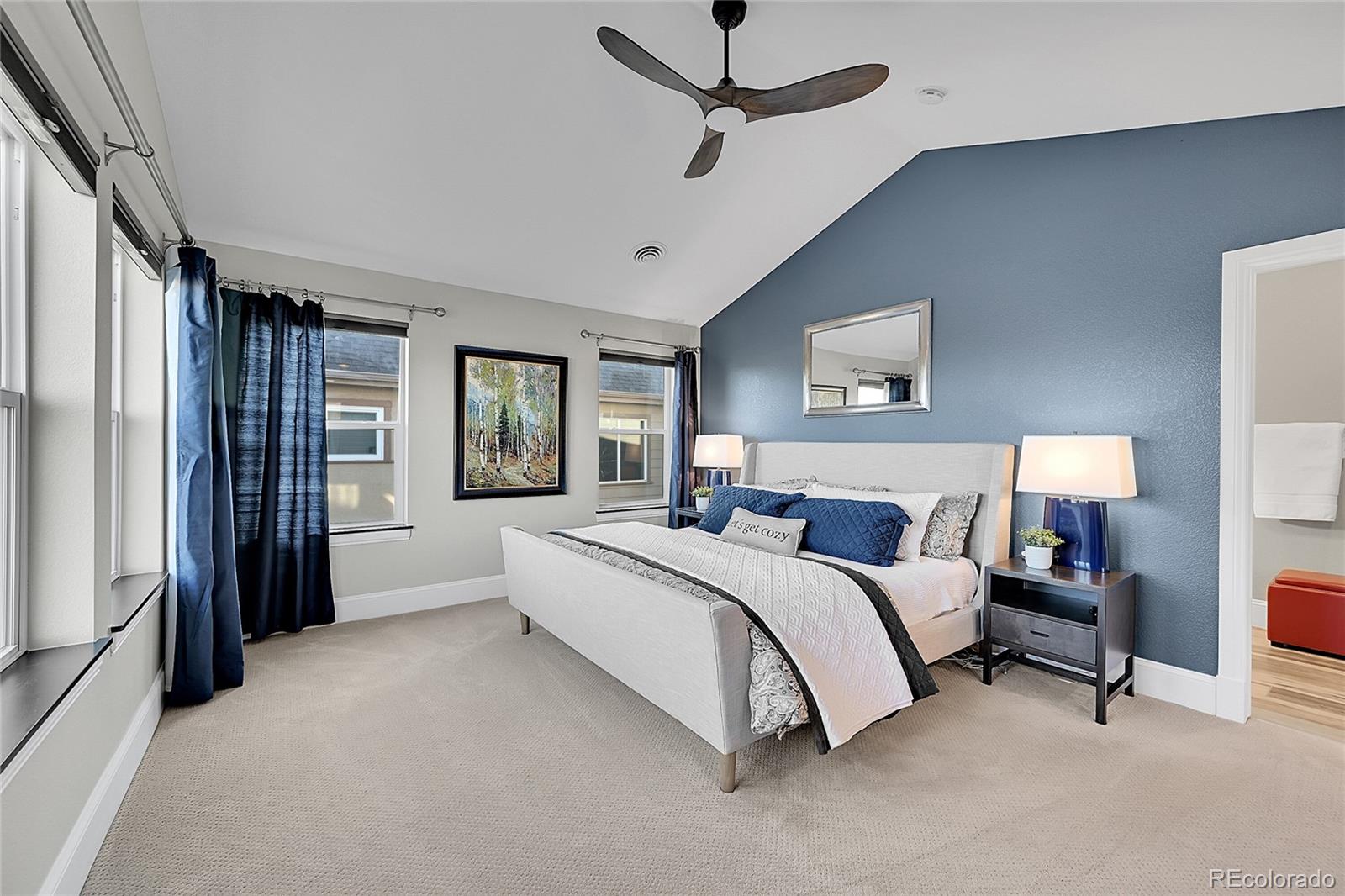 3693 Silverton Street Boulder, CO 80301 - Photo 19 of 50 a spacious bedroom with a bed couch and a window