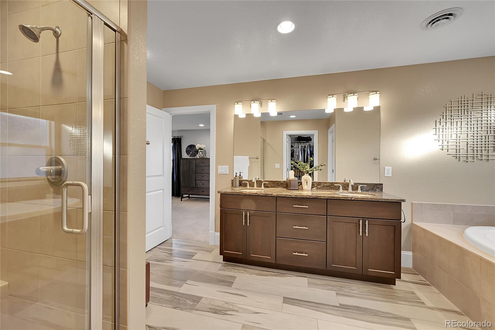 3693 Silverton Street Boulder, CO 80301 - Photo 25 of 50 a bathroom with a granite countertop sink mirror and shower