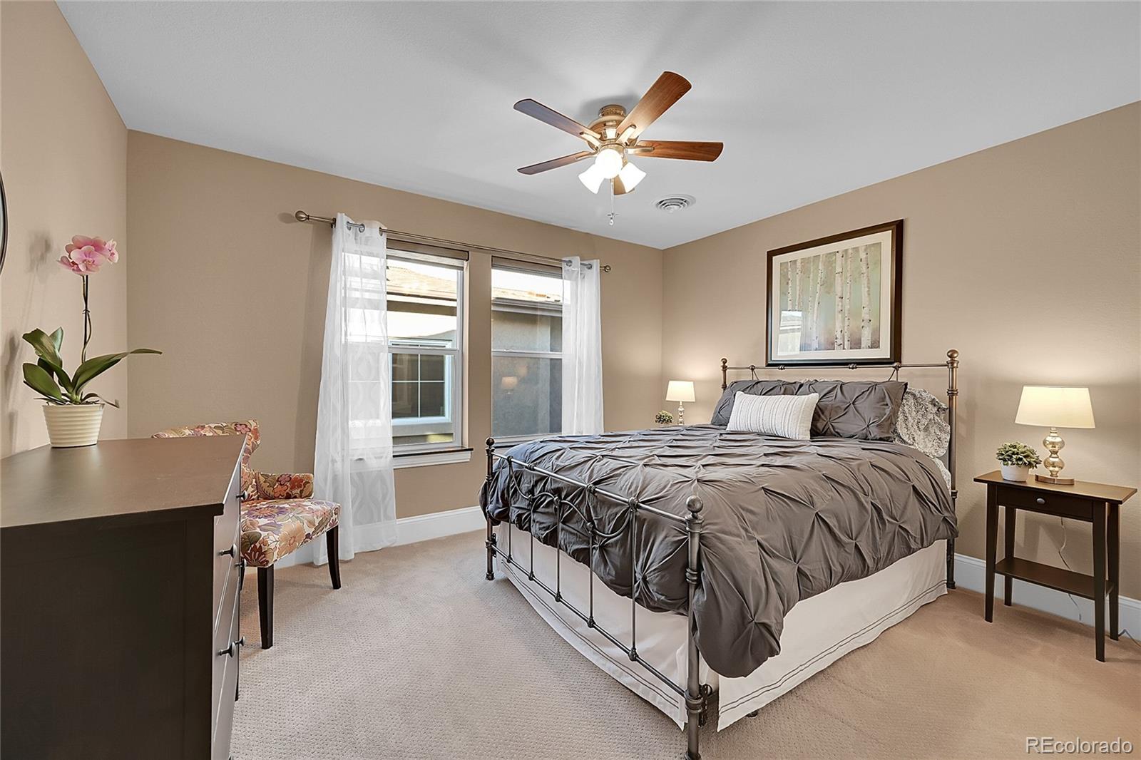 3693 Silverton Street Boulder, CO 80301 - Photo 28 of 50 a spacious bedroom with a bed and a table in it