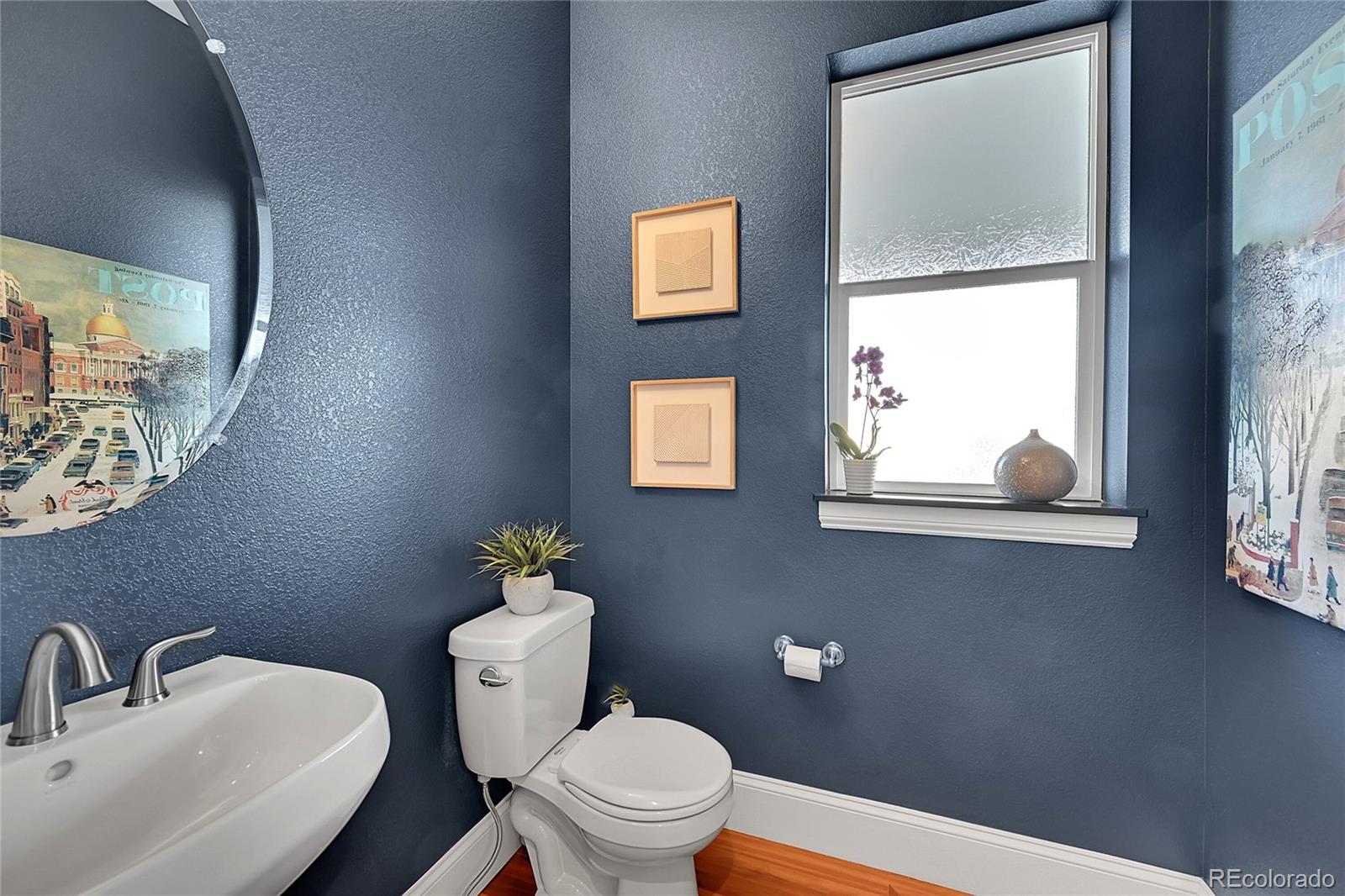 3693 Silverton Street Boulder, CO 80301 - Photo 9 of 50 a white toilet sitting next to a bathroom sink