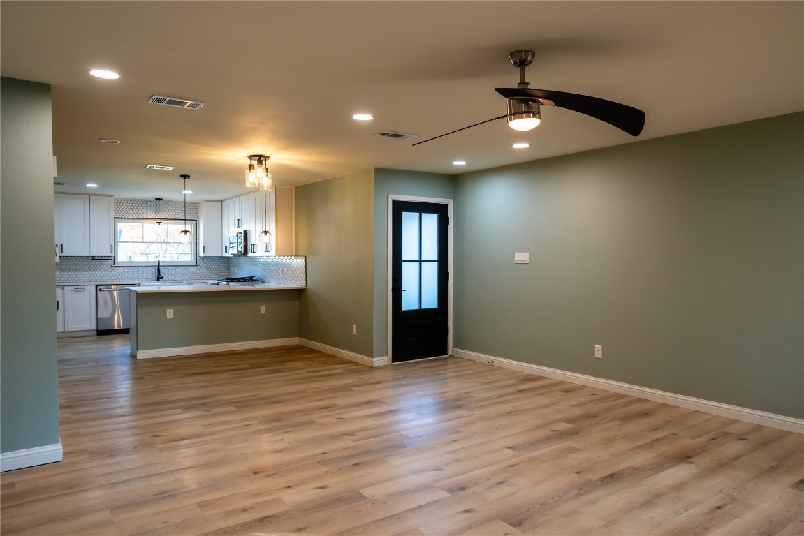 9828 Briar Ridge Drive Austin, TX 78748 - Photo 17 of 17 Front entrance showing the open floorplan of the living, dining, and kitchen.