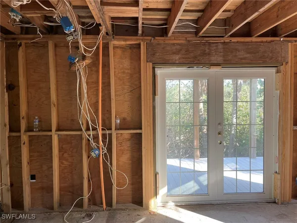 a view of a room with wooden floor
