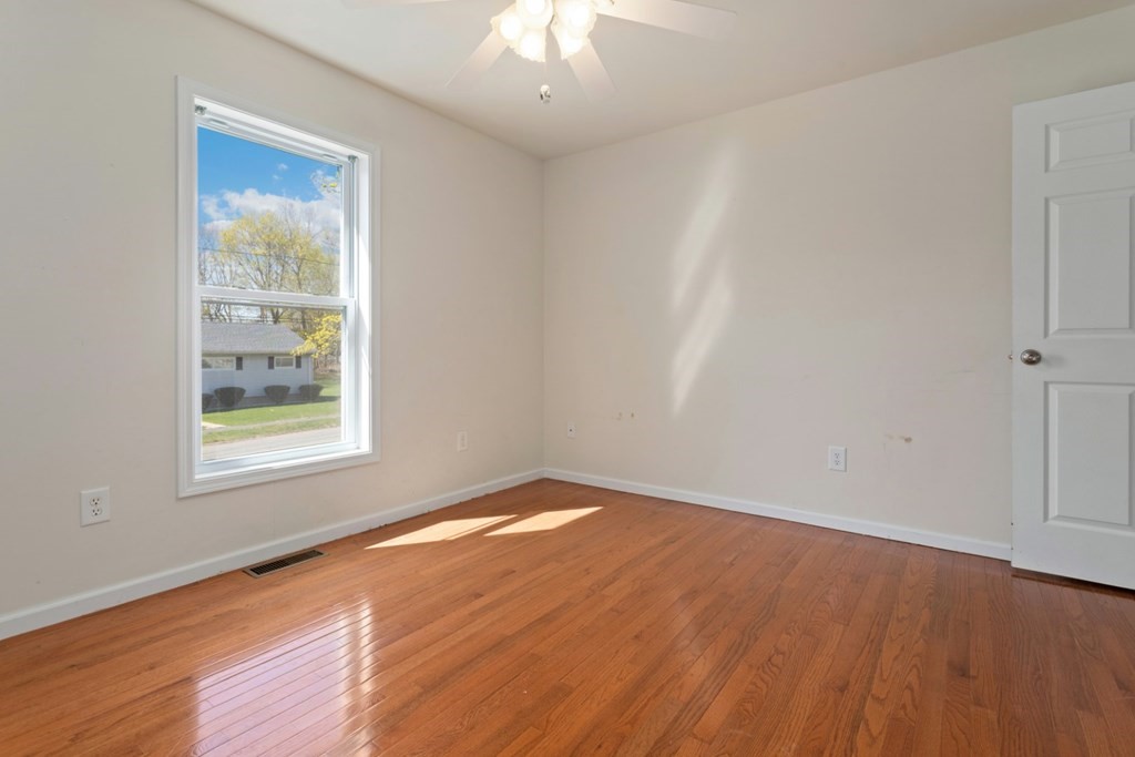 2 Earley Road Peabody, MA 01960 - Photo 11 of 30 a view of an empty room with wooden floor and a window