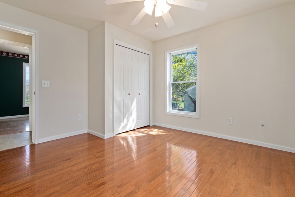 2 Earley Road Peabody, MA 01960 - Photo 12 of 30 a view of an empty room with wooden floor and a window