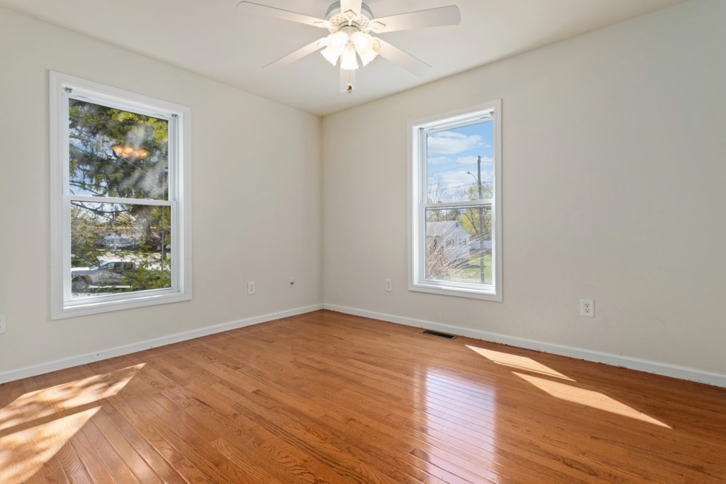 2 Earley Road Peabody, MA 01960 - Photo 13 of 30 a view of an empty room with wooden floor and a window