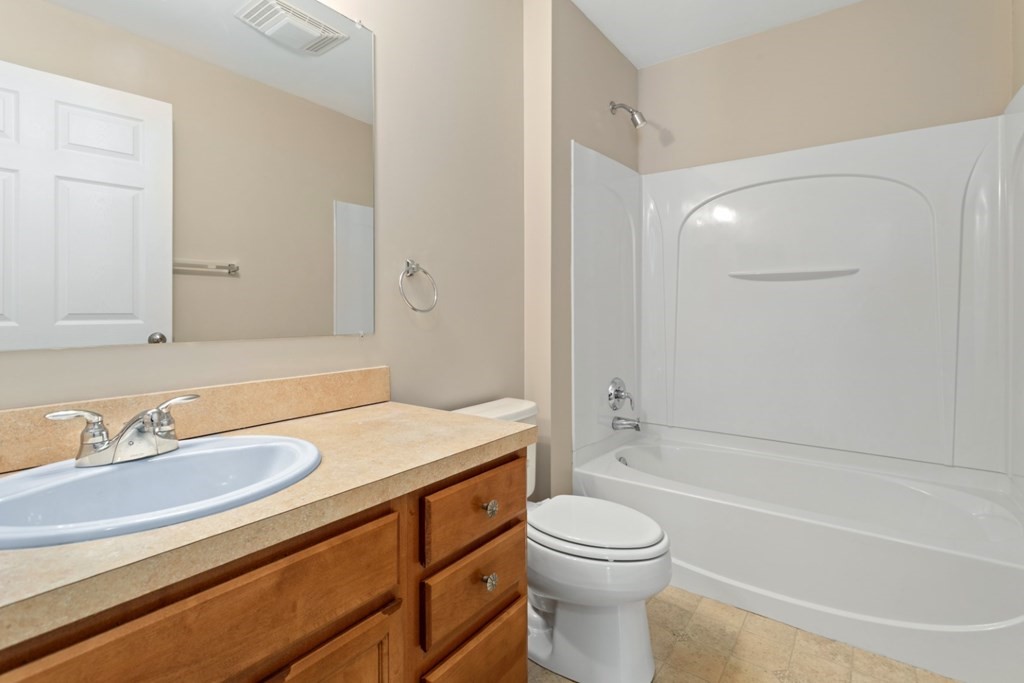 2 Earley Road Peabody, MA 01960 - Photo 14 of 30 a bathroom with a sink a toilet and a bathtub