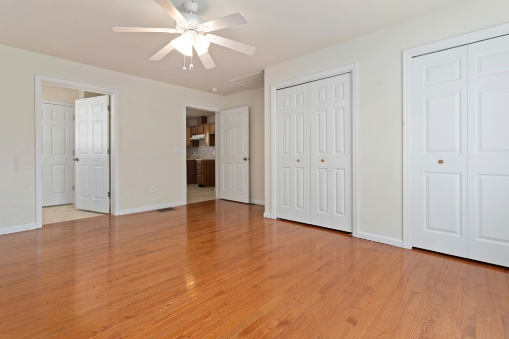 2 Earley Road Peabody, MA 01960 - Photo 17 of 30 a view of an empty room with window and wooden floor