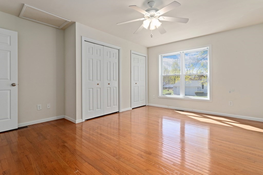 2 Earley Road Peabody, MA 01960 - Photo 18 of 30 a view of an empty room with wooden floor and a window