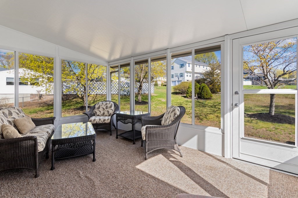 2 Earley Road Peabody, MA 01960 - Photo 22 of 30 a living room with furniture and a floor to ceiling window