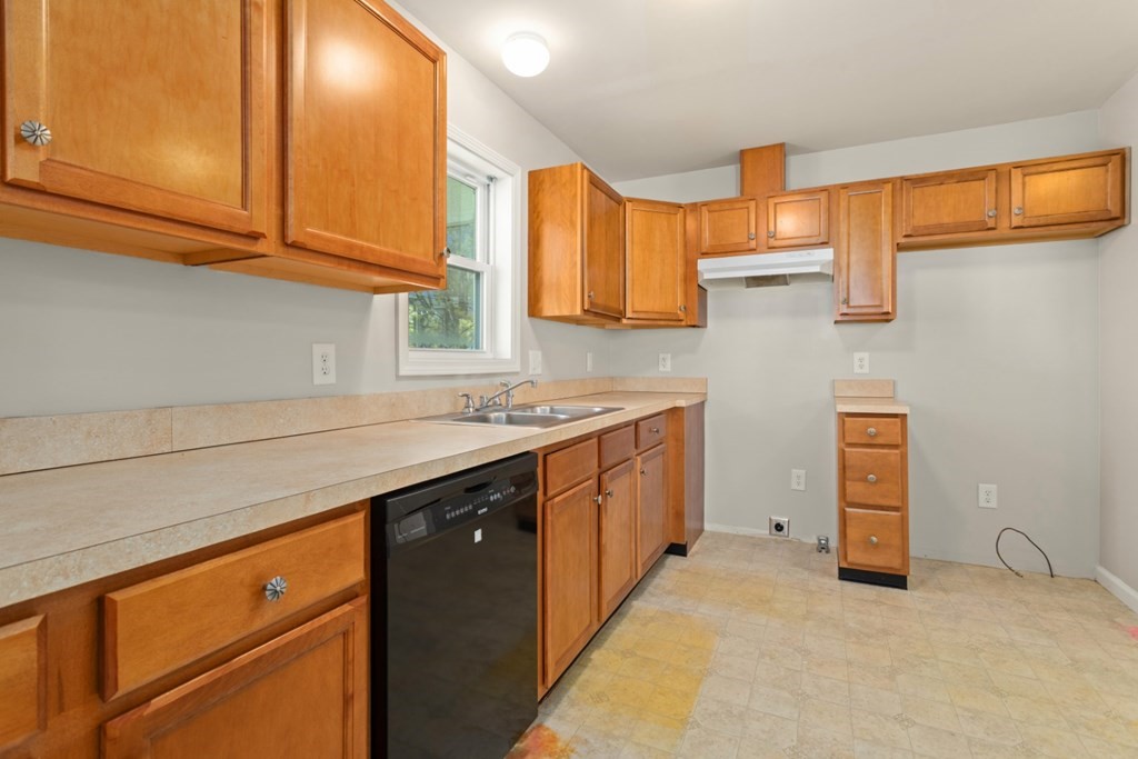 2 Earley Road Peabody, MA 01960 - Photo 8 of 30 a kitchen with granite countertop a sink dishwasher stove and cabinets