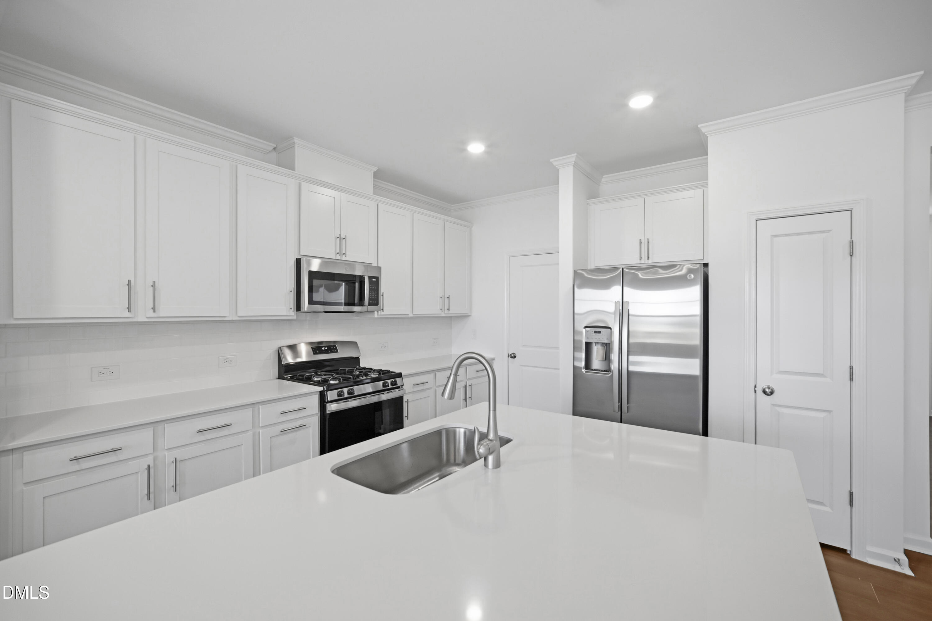 2915 Hickory Fld Drive Raleigh, NC 27616 - Photo 11 of 30 a kitchen with stainless steel appliances granite countertop a refrigerator sink and cabinets