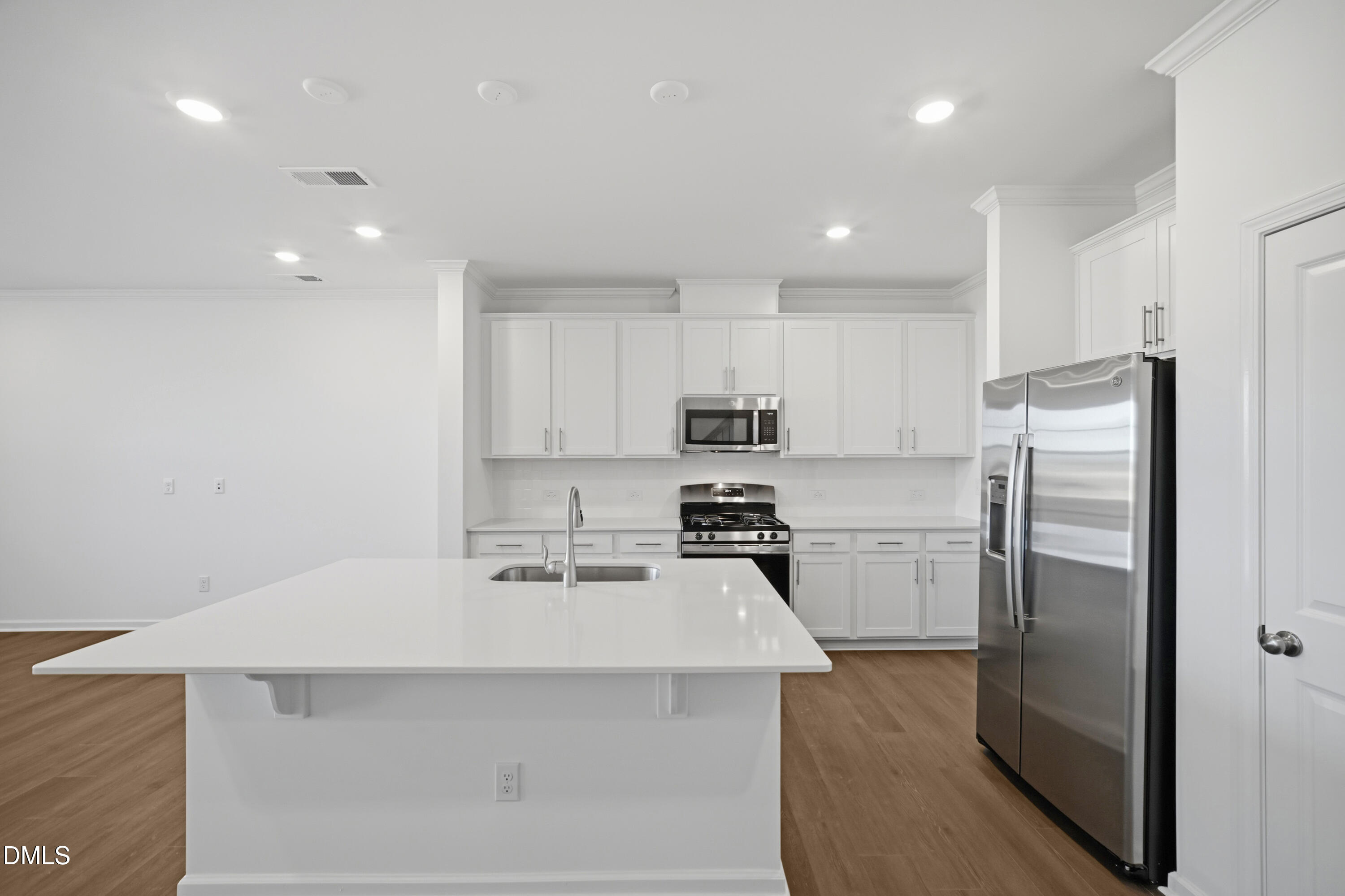 2915 Hickory Fld Drive Raleigh, NC 27616 - Photo 12 of 30 a kitchen with stainless steel appliances a refrigerator sink and stove