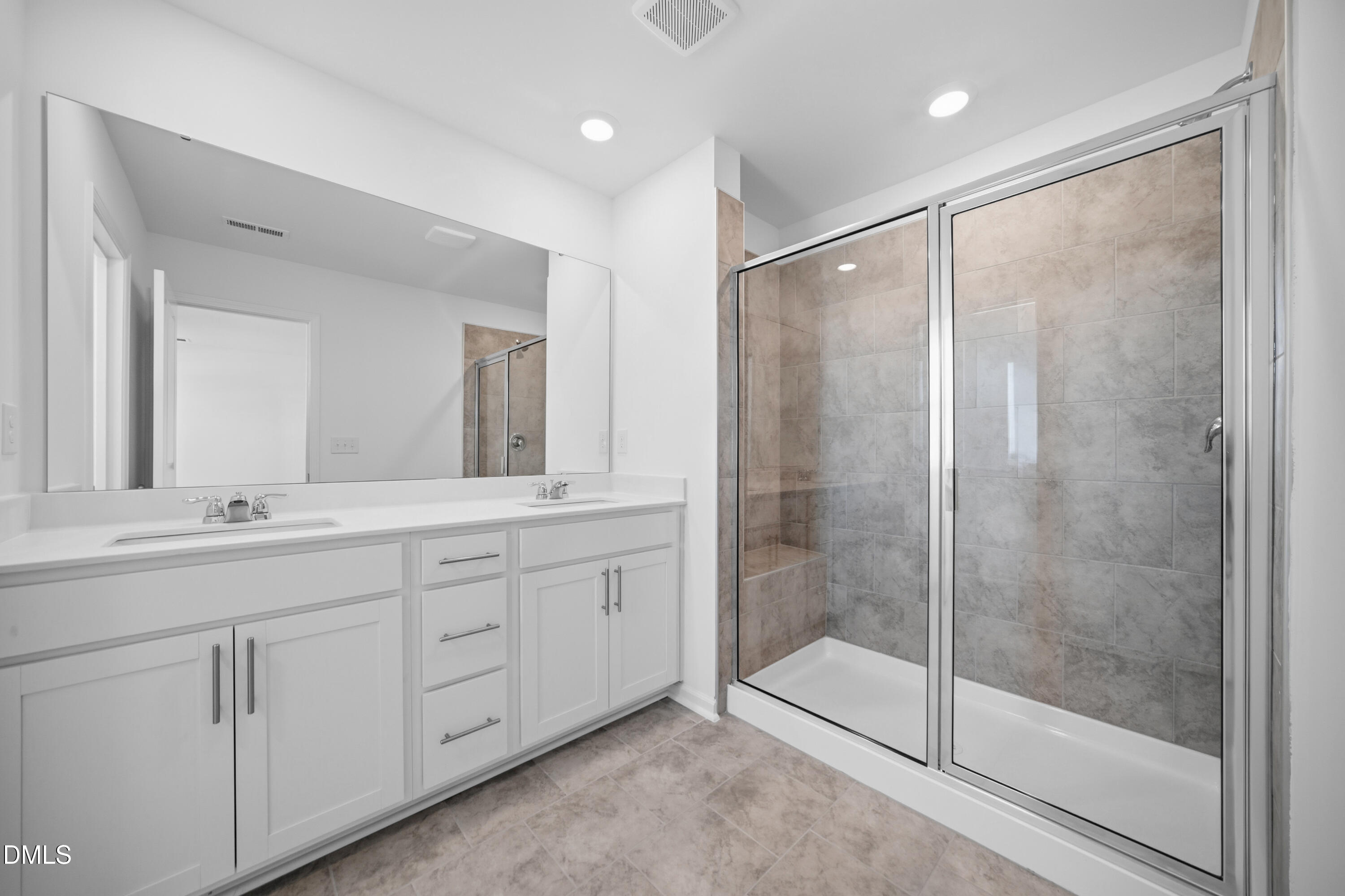 2915 Hickory Fld Drive Raleigh, NC 27616 - Photo 28 of 30 a bathroom with double sink and a mirror