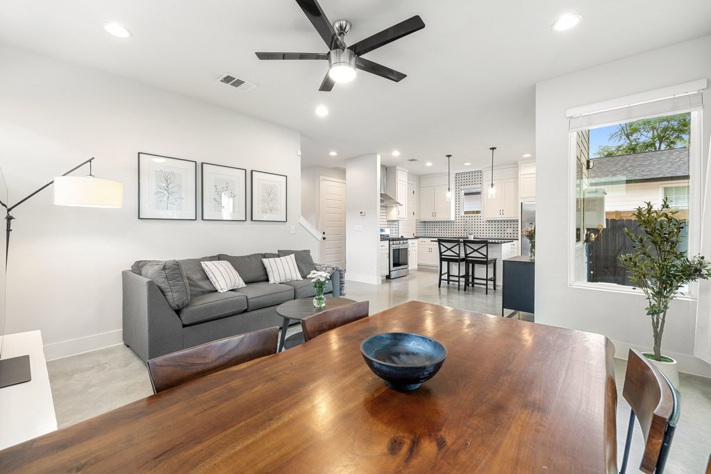 1182 Ridgeway Drive, Unit A Austin, TX 78702 - Photo 11 of 35 a living room with lots of furniture and view of kitchen