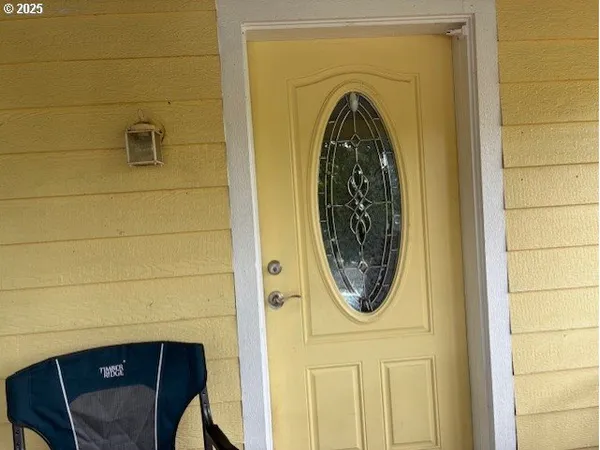 a view of a door and a utility room