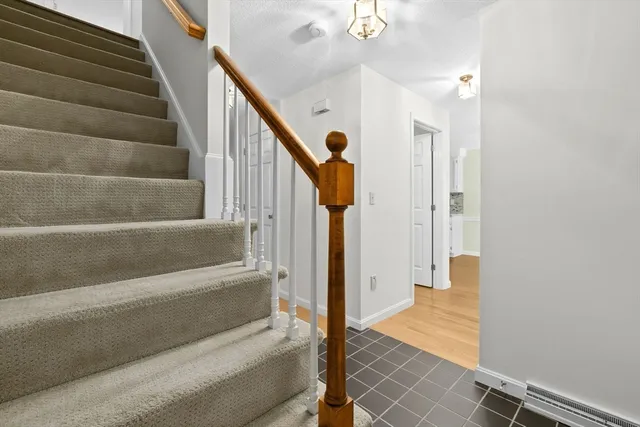 a spacious bedroom with a bed a couch and a window