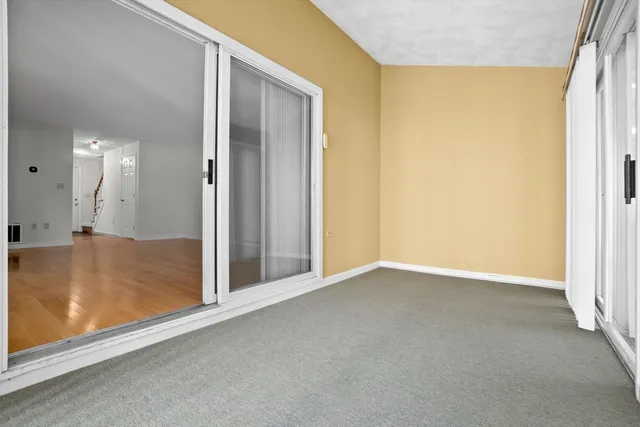 a view of house with backyard and outdoor seating