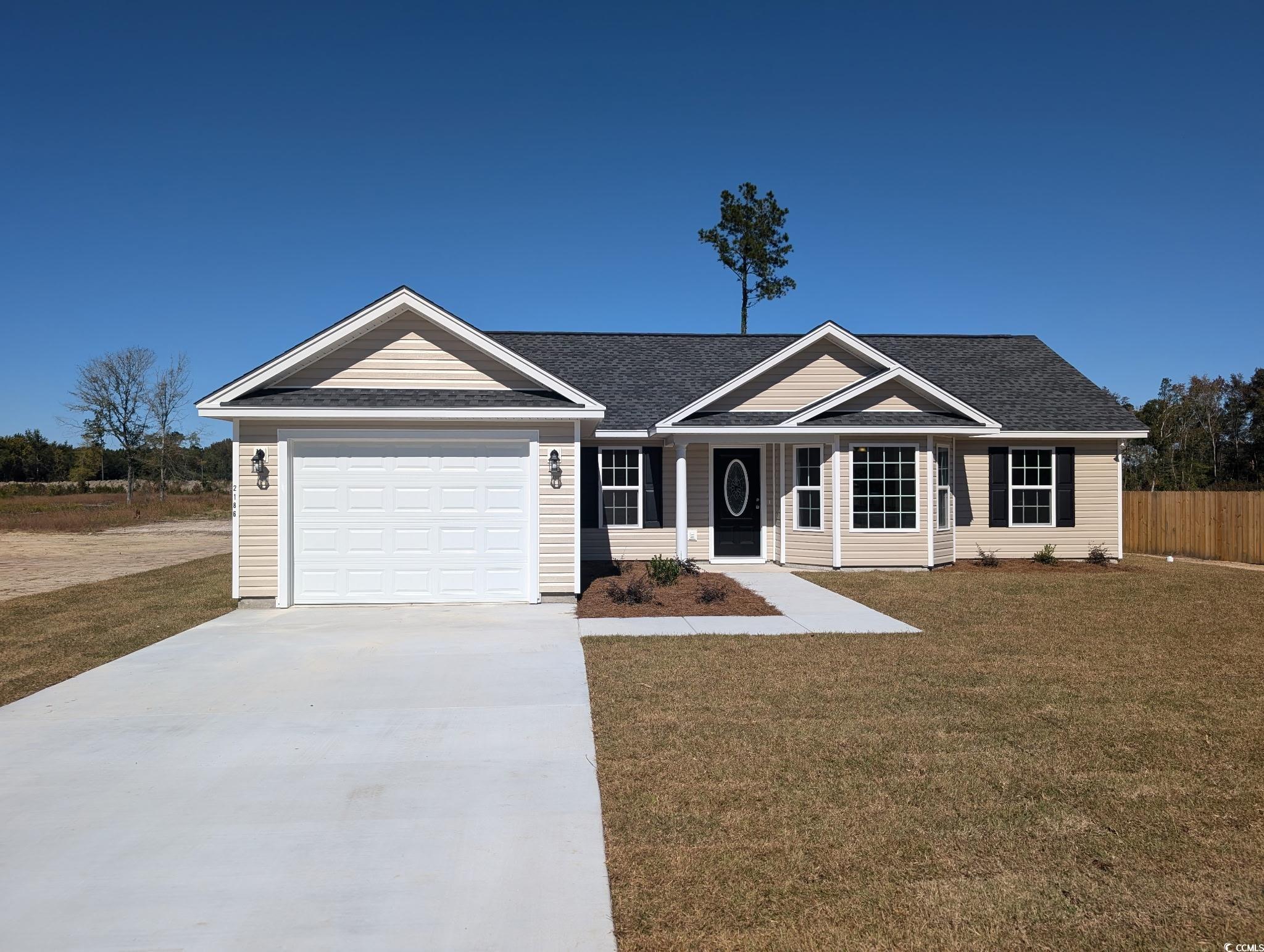 2186 Mineral Springs Road Conway, SC 29527 - Photo 1 of 14 Ranch-style house with a garage, roof with shingles, and a porch
