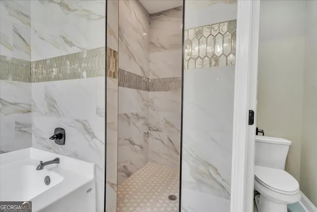 a bathroom with a bathtub and shower