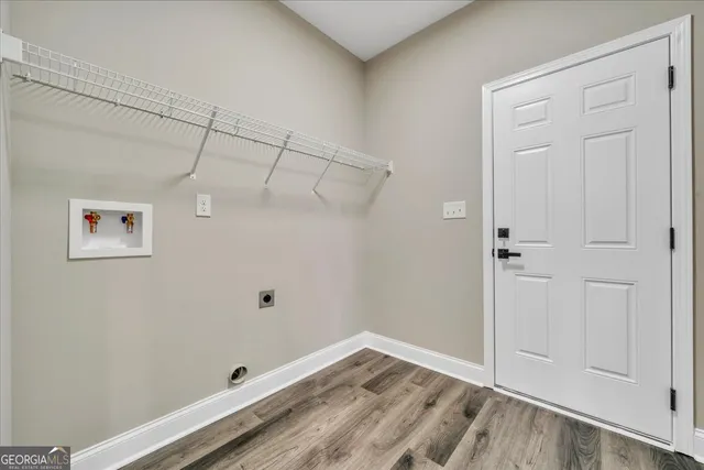 a view of a small space with wooden floor