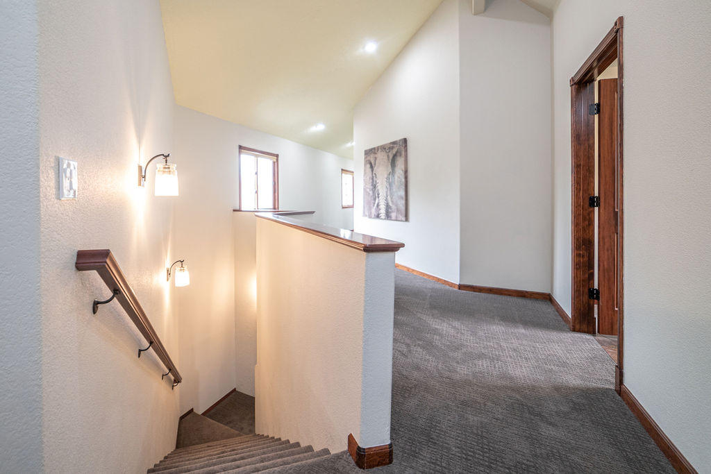 60675 Billadeau Road Bend, OR 97702 - Photo 45 of 87 There is also a back staircase that leads to the side entry of the home.