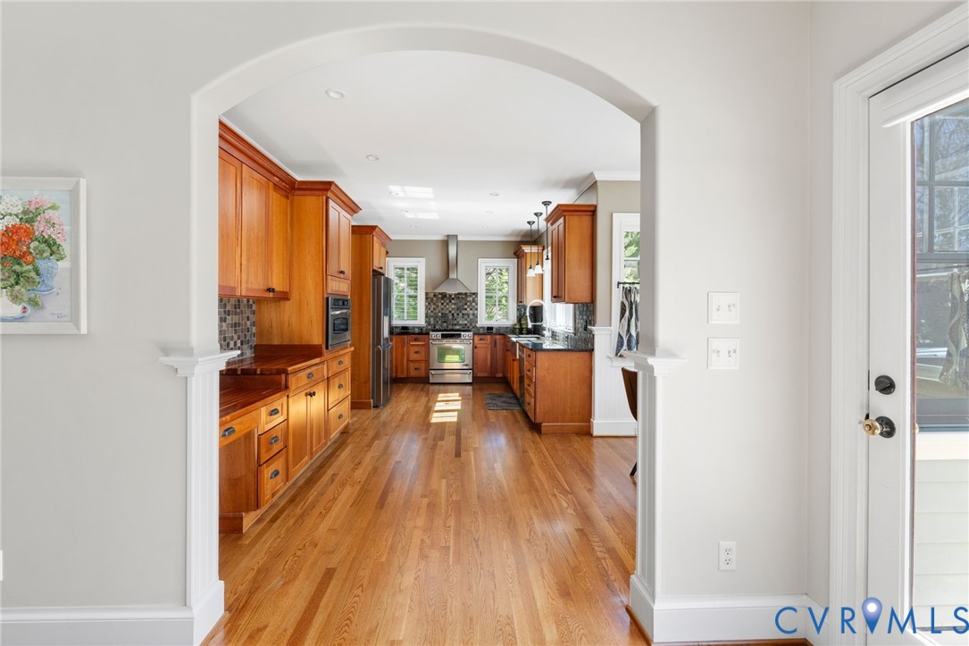 8947 Cherokee Road Richmond, VA 23235 - Photo 18 of 45 a view of a living room hardwood floor and a kitchen