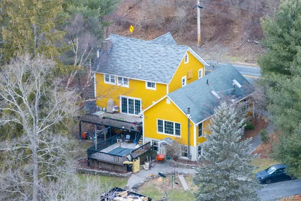 a aerial view of a house with swimming pool and sitting space