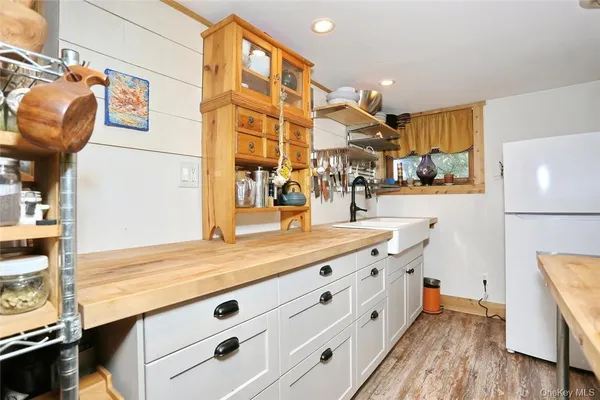 a bathroom with a sink a vanity and a mirror