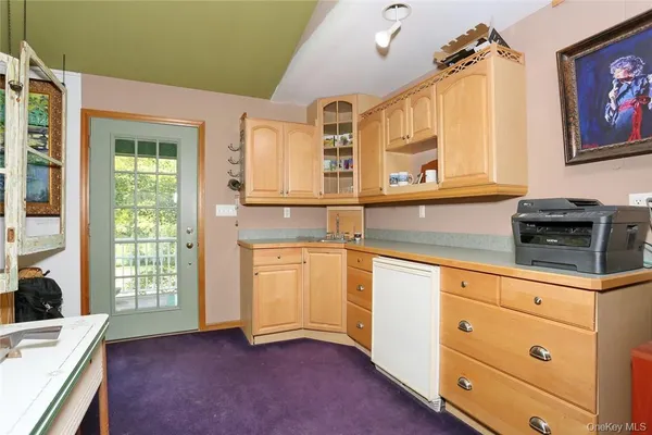 a view of a livingroom with furniture and a floor to ceiling window