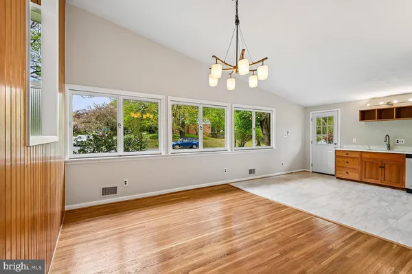 a kitchen with stainless steel appliances granite countertop a refrigerator and a stove