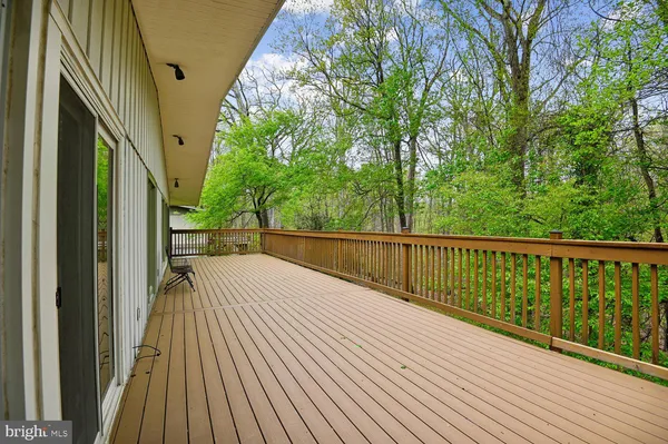 a balcony with wooden floor