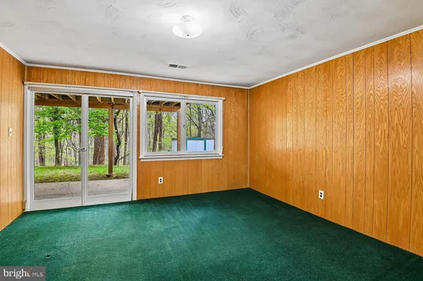a view of an empty room and window