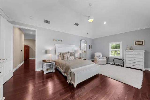 a bedroom with a bed and a couch